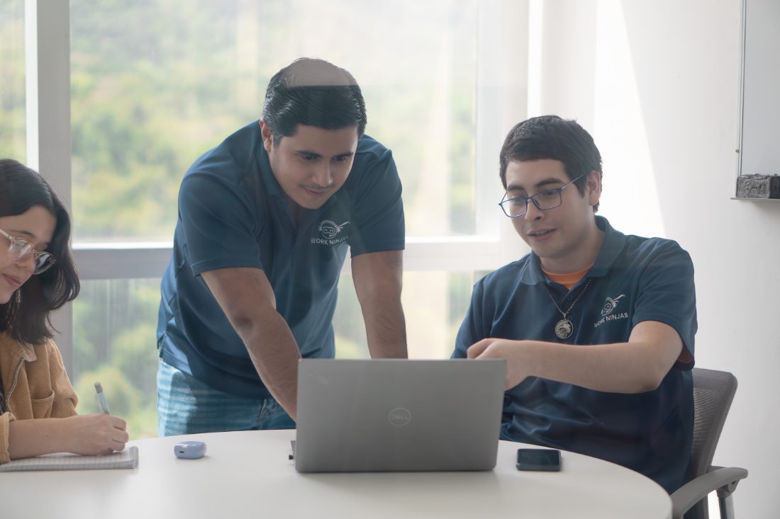 The Work Ninjas team collaborating in branded polos